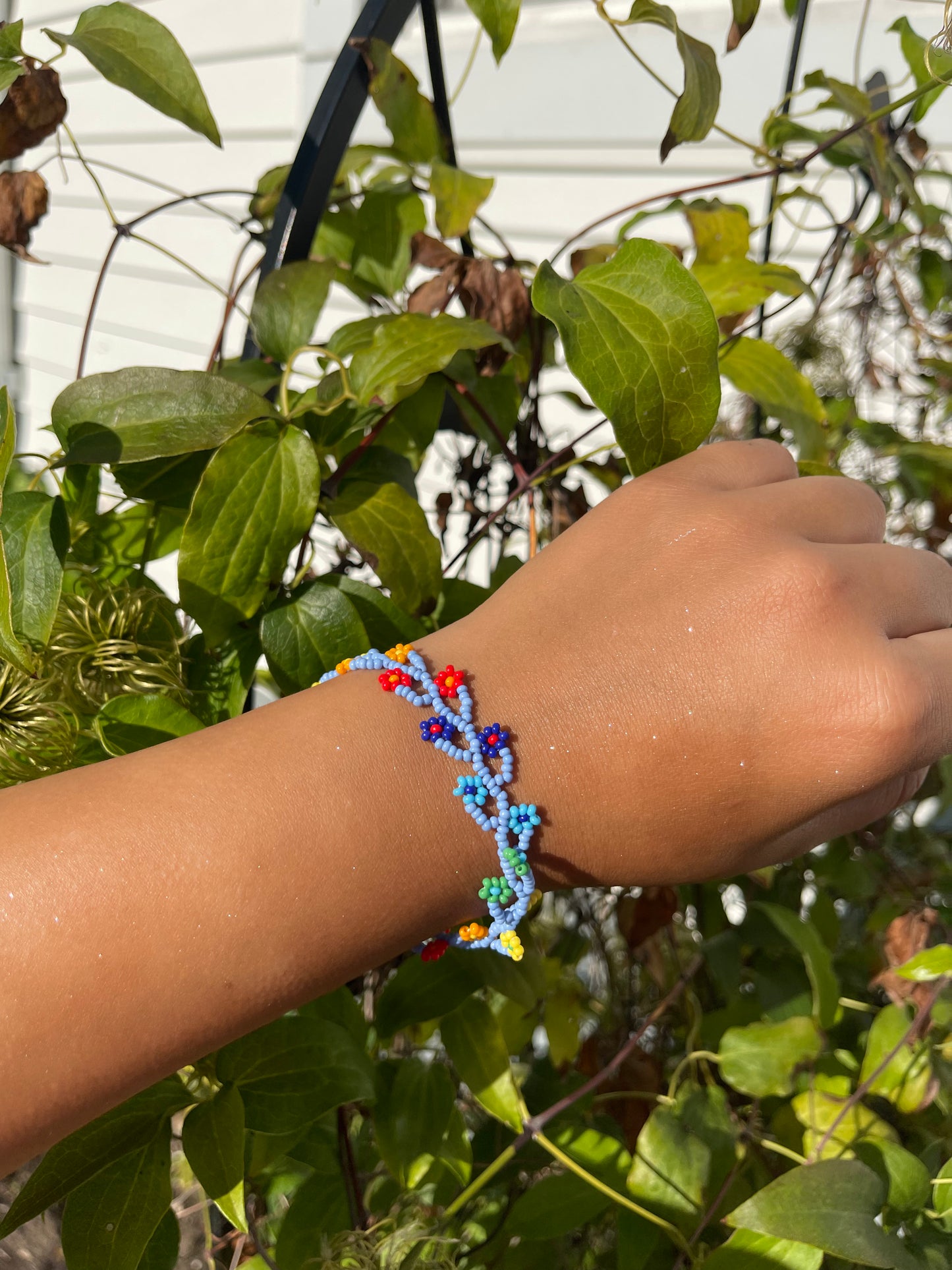 Blue,red,orange, and yellow flower bead bracelet